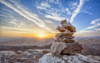 Stone monument at sunset.